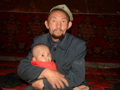06 Yilik Headman With His Grandchild On The Way To K2 China Trek.jpg